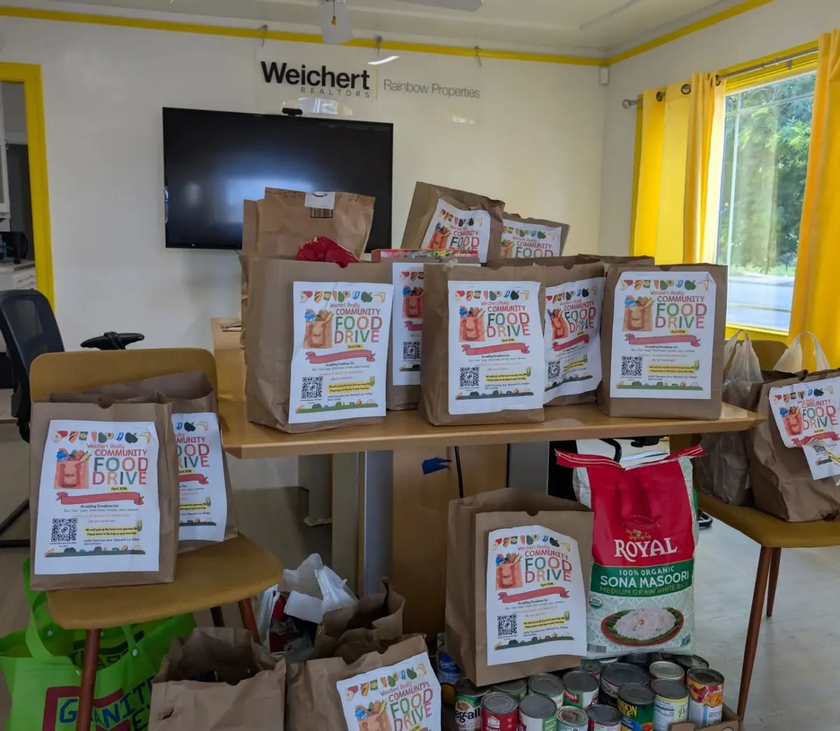 Collected food-drive bags and pantry staples at the office