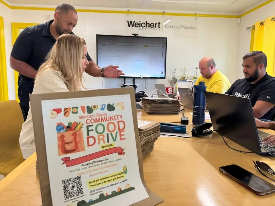 Team members preparing the food drive at the brokerage office